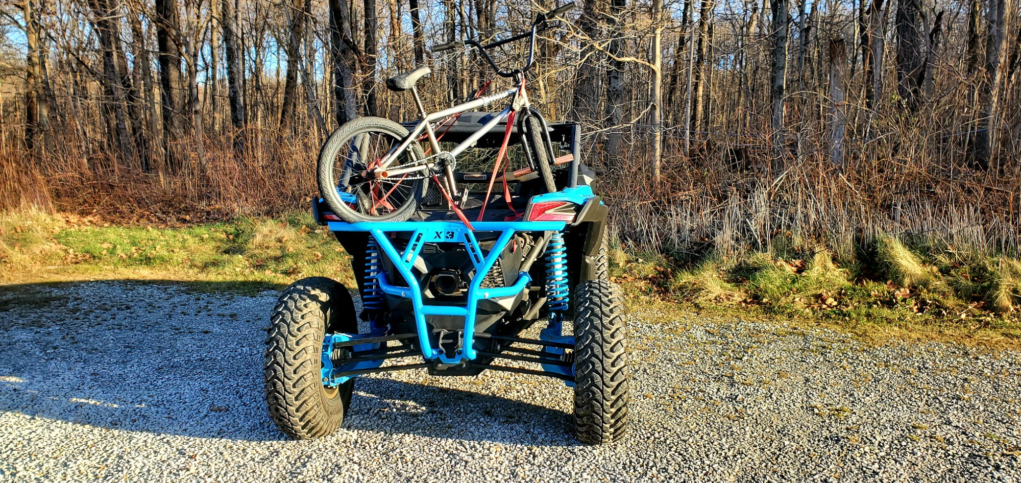 Rear shot of 2021 Can Am Maverick UTV with Gladiator XComp tires